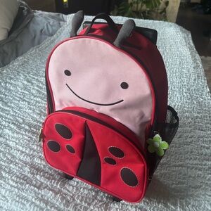 Skip Hop Lady Bug travel bag with wheels and pull out handle